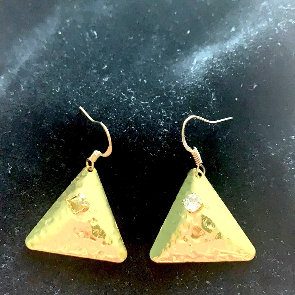 Gold pyramid earrings.
